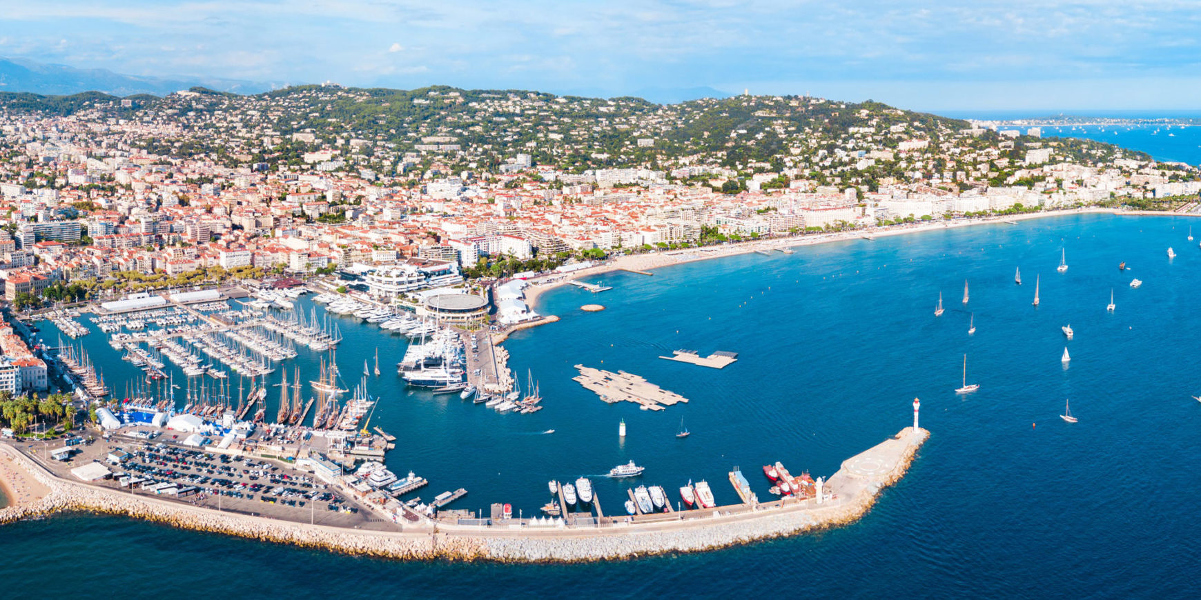 Beautiful Cannes coastline on a sunny day, bright blue waters.