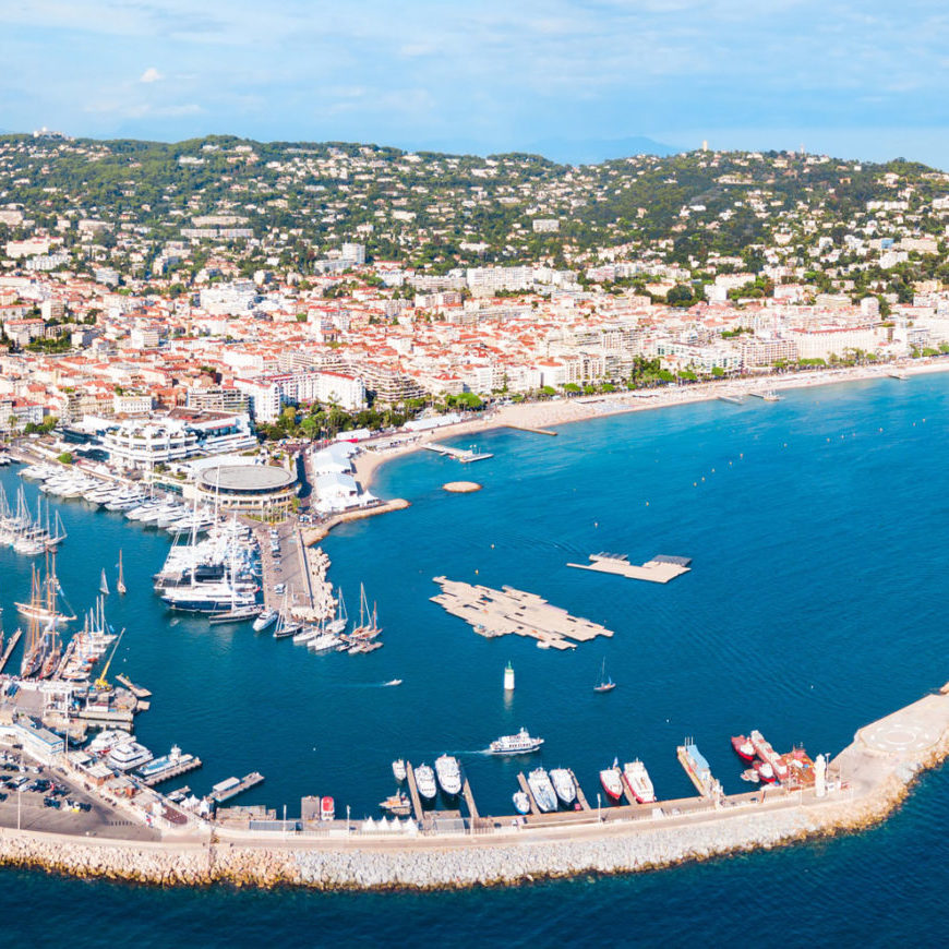 Beautiful Cannes coastline on a sunny day, bright blue waters.