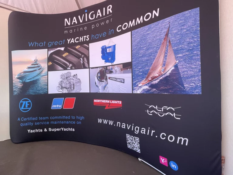 Navigair's banner at Cannes Yachting Festival showing the logo of all their partners.